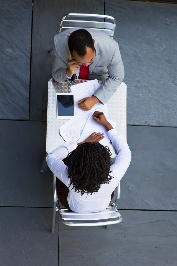 African American managers working with documents